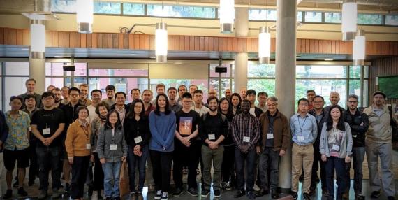 10 people standing and smiling at an econ event