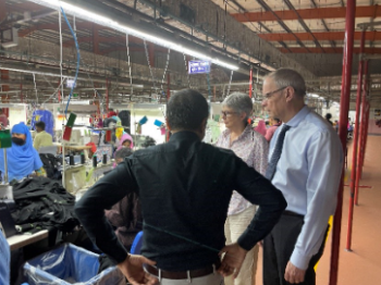 Jean Tirole visiting a garment factory. 