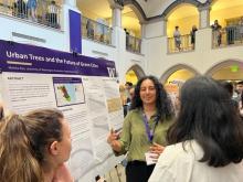 Photo of Mahika Rao presenting her research poster
