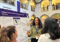 Photo of Mahika Rao presenting her research poster